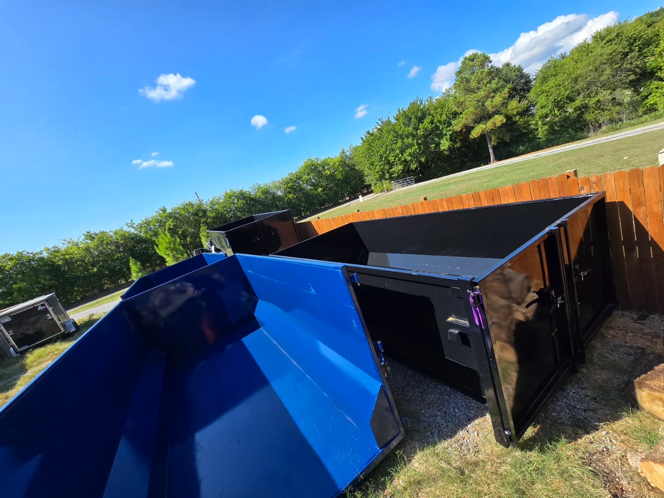 Gentry Dumpster Rentals 15, 20 and 25 yard dumpsters lined up at the Sherman TX yard