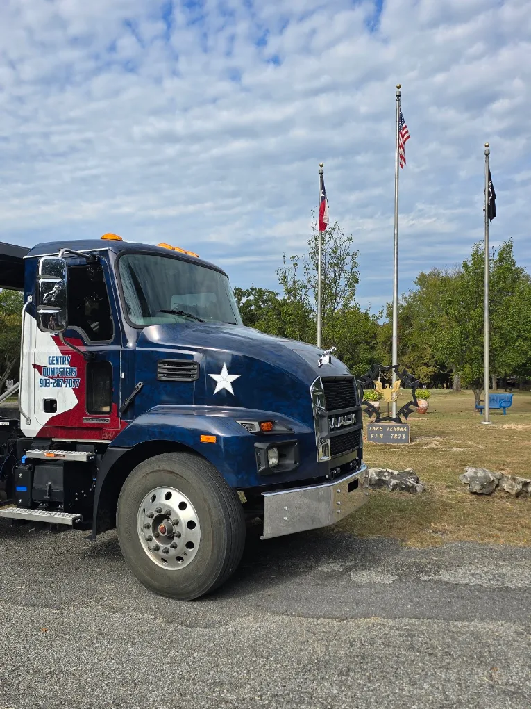 Gentry Dumpster Rentals branded hauling truck in Sherman, TX