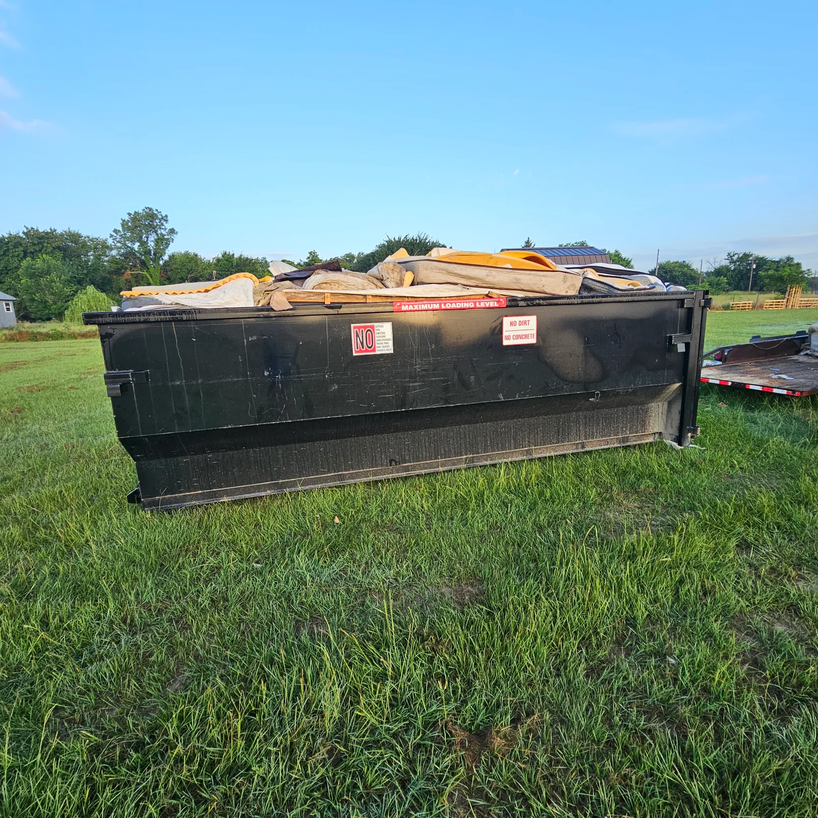 Gentry Dumpster Rentals dumpster on a home and garage cleanouts job in Gainesville